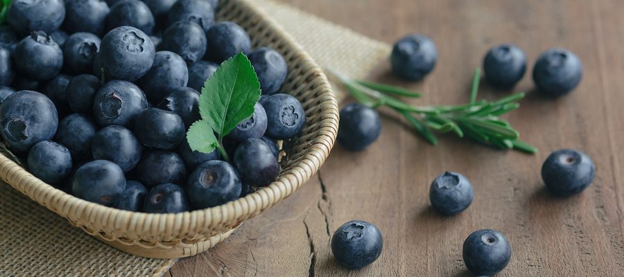 Fresh Wild Blueberries In Wood Basket On Sack. Wild Blueberry Pu