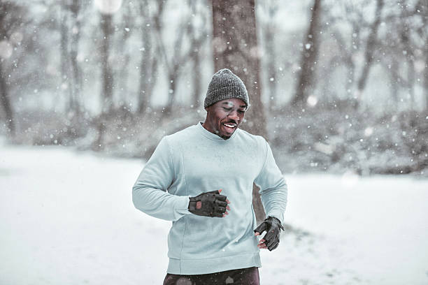 Black man running in snow